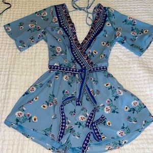 Boutique Romper. Floral and trendy piece! Perfect for spring!!